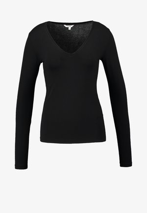 Mustaga pikkade varrukatega topp sügava V-kaelusega, valmistatud pehmest materjalist, millel on vormiv disain ja sile tekstuur, ilma märkide või aktsentideta.