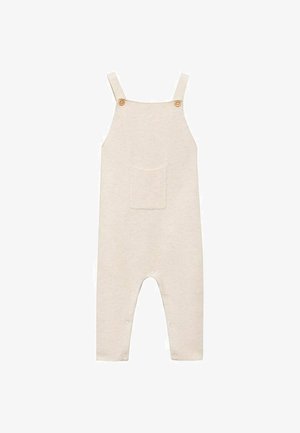Beige cotton overall with wide shoulder straps and wooden buttons, featuring a front pocket and snap closures at the bottom for easy dressing.