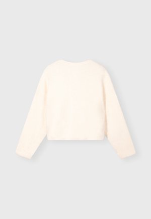Geknipte crème trui met lange mouwen, zachte textuur, ronde halslijn en minimale naden. Geschikt voor casual layering.