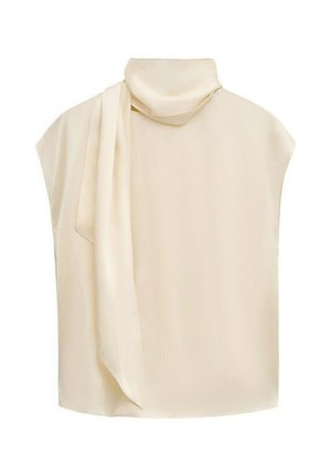 Blusa sin mangas de color crema con cuello alto y detalle de bufanda larga que cae por el frente.