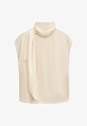 Blusa sin mangas de color crema con cuello alto y detalle de bufanda larga que cae por el frente.