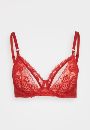 Sutiã vermelho de renda com copas transparentes, padrões florais e alças vermelhas ajustáveis. Apresenta uma forma triangular e um acabamento decorativo ao longo das bordas.