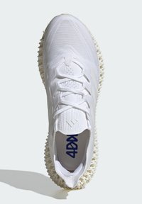 White athletic shoe with a textured upper, featuring a lace-up design, cushioned collar, and a unique, sculpted rubber sole.