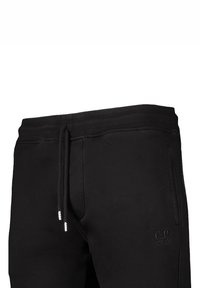 Schwarze Sweatpants aus weichem Stoff, mit einem elastischen Bund und Kordelzug sowie einem dezenten Logo auf dem Oberschenkel.