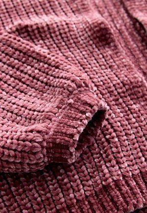 Textured, plush fabric in a muted rose color; features distinctive loops and a cozy, thick weave; soft to the touch and inviting.