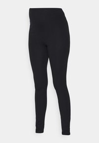 Fekete leggings sima felülettel, magas derékvarrással és testhez simuló kialakítással, amelyek a bokák felé keskenyednek, így karcsú sziluettet biztosítanak.