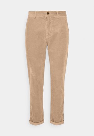 Beige corduroy broek met een slim fit, voorzien van opgerolde boorden, een knoopsluiting aan de voorkant en een gestructureerd ribbelpatroon.