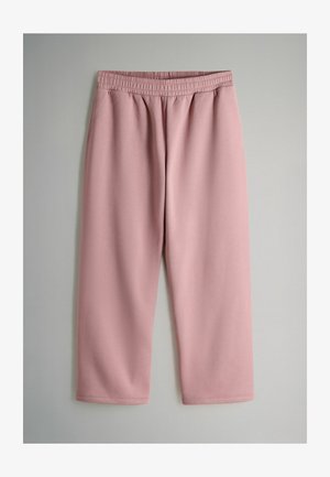 Różowe, miękkie spodnie z elastycznym pasem, o luźnym kroju i prostych nogawkach, bez kieszeni i ozdób.