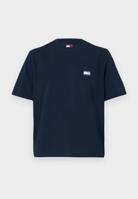 Navy blue cotton t-shirt with short sleeves, crew neck, and a small logo patch on the left chest featuring the text "TOMMY JEANS."