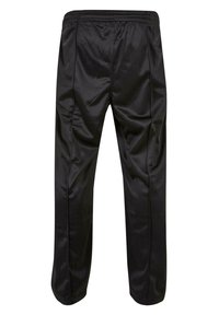 Čierne syntetické športové nohavice s elastickým pásom a slim fit strihom. Vyznačujú sa hladkým povrchom a zúženými nohavicami. Vhodné na aktívne nosenie.