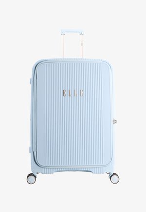 Light blue hard-shell suitcase with textured vertical lines, four spinner wheels, telescopic handle, and "ELLE" brand name on front panel.