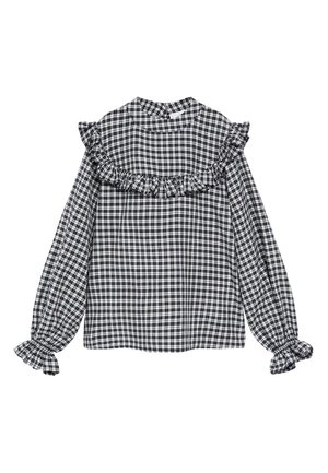 Blouse à manches longues à carreaux noirs et blancs avec un bord volanté sur la poitrine, les épaules et des poignets élastiques à volants.