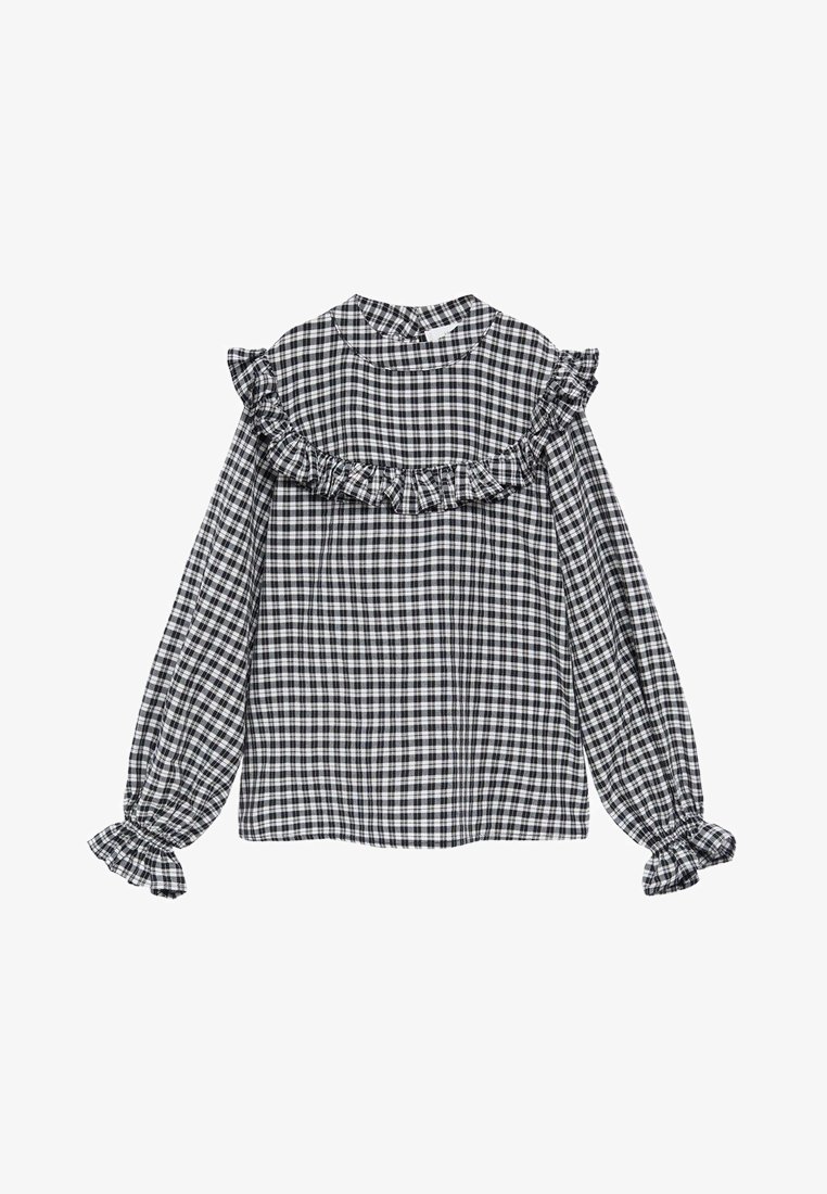 Blouse à manches longues à carreaux noirs et blancs avec un bord volanté sur la poitrine, les épaules et des poignets élastiques à volants.