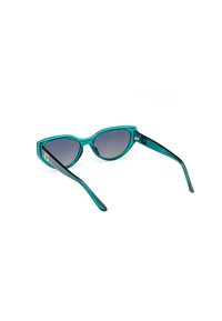 Gafas de sol de cat-eye con montura transparente color teal, lentes degradados en gris y brazos negros con sutiles detalles de logo. Acabado brillante.