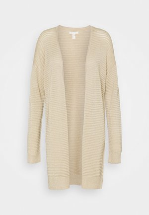 Cardigan beige en maille côtelée à ouverture devant, manches longues et coupe décontractée, présenté sur un fond uni.