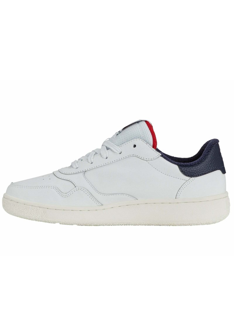 White leather sneaker with a textured rubber sole. Navy and red accents on the heel and collar. Features round laces and perforated detailing.