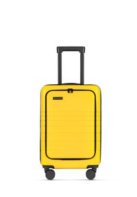 Geel hardshell koffer met een gestroomlijnd ontwerp, gestructureerde ribbels, zwarte ritsen en een uitschuifbare handgreep. Beschikbaar met vier wielen voor mobiliteit.