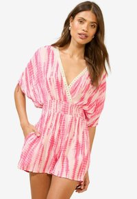 Pink tie-dye romper with a deep V-neck, wide sleeves, elastic waistband, and pockets; features metallic accents along the neckline.