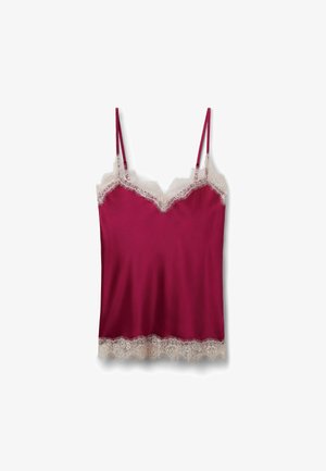 Caraco en satin rose profond avec fines bretelles, bordure en dentelle blanche le long de l'encolure et de l'ourlet, posé à plat sur fond blanc.