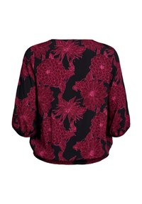 Blouse noire avec une coupe ample, ornée d'un motif floral en bordeaux. Manches longues avec des poignets froncés et une ourlet arrondi.