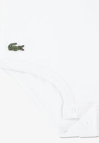 Lacoste MON PREMIER UNISEX SET - Treniņtērps - light pink