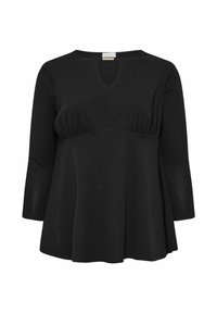 Mustapaita pitkillä hihoilla V-pääkohdalla ja kankaalla keräily yksityiskohdat rinnan alla, jossa on virtaava siluetti ja pehmeä, tekstuuri kangas.