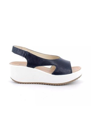 Sandalo nero in pelle con punta aperta e cinturino posteriore, suola zeppa piattaforma bianca e sottopiede imbottito beige.