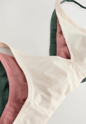 Behå av mjukt tyg med en färgblockdesign i kräm, rosa och mörkgrön. Den har justerbara axelband och släta sömmar.