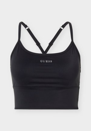 Zwarte sportbeha met dunne verstelbare gekruiste bandjes en zilverkleurige "GUESS"-logo centraal aan de voorkant.