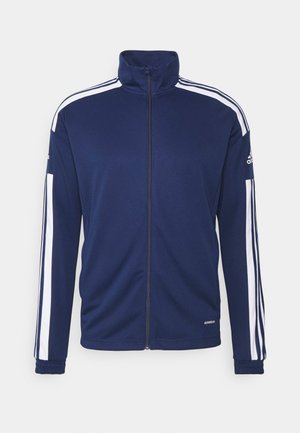 Giacca zip-up di colore blu navy realizzata in tessuto morbido, con strisce bianche sulle spalle e sulle maniche, polsini a costine e logo del brand sulla manica.