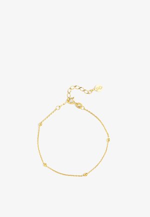 Pulsera de cadena de oro con pequeñas cuentas redondas. Presenta un cierre de broche y longitud ajustable con una cadena de extensión. Textura suave.