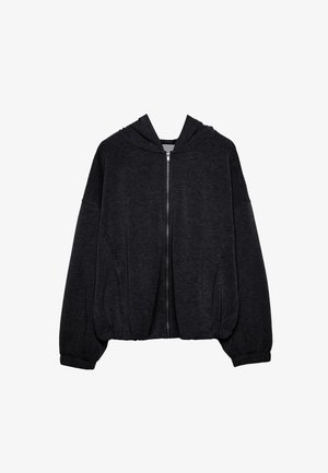 Schwarze Zip-Hoodie aus weichem Stoff. Hat einen lässigen Schnitt, weite Ärmel und eine Kapuze mit Kordelzug sowie elastische Bündchen und Saum.