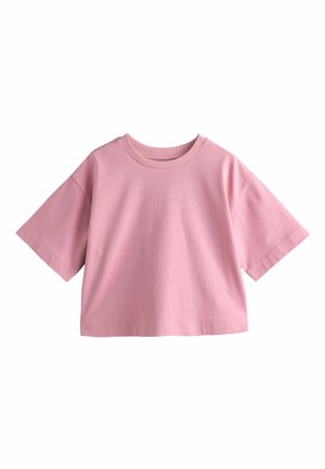 Loose-fitting short-sleeve cropped T-shirt in solid pink with a round neckline on a white background.