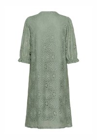 Müntroheline pitskleit lillemustriga, lühikeste puhvvarrukatega ja volditud detailidega. Kerge kangas, põlve pikkusega ja mugava lõikega.