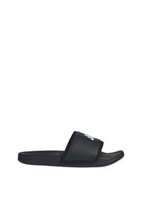 Black slide sandal with a perforated upper, flat rubber sole, and contrasting white logo detail on the strap. Minimalist design, lightweight.