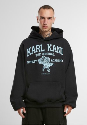 Black hoodie featuring a front kangaroo pocket, blue graphic text, and an eagle design. Made of soft fabric with a relaxed fit.