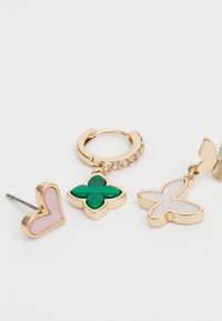 Gold-tone earrings featuring a pink heart stud, a green flower charm, and a white butterfly charm. Each piece has a polished finish.