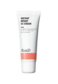 Tubo bianco di Instant Bright CC Cream con testo nero e una fascia di accento corallo alla base, caratterizzato da una finitura opaca liscia.