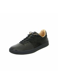 Schwarze Sneakers aus Leder und Wildleder mit strukturiertem Finish, Schnürdesign und kontrastierender beiger Innenausstattung. Gummisohle.