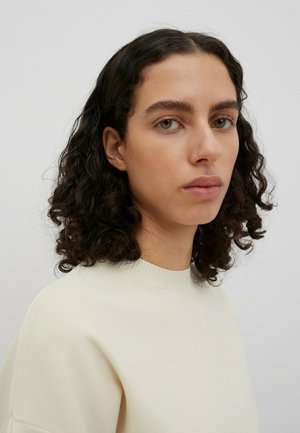 EDITED BABETTE - Jumper dress - beige