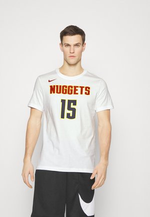 White short-sleeve t-shirt with red and yellow "NUGGETS" text and black "15" on the front. Features a red Nike logo on the left shoulder.