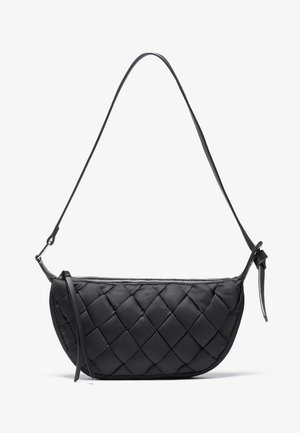 Black quilted leather shoulder bag with long adjustable strap and zip closure, angled slightly to show front and side details.