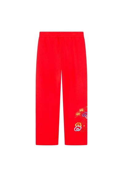 Pantalon en coton rouge à coupe droite, avec des motifs floraux brodés colorés sur le bas et une taille élastique.