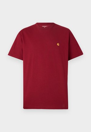 Red cotton t-shirt with a crew neckline, short sleeves, and a small gold logo on the left chest. Soft texture and straight cut design.