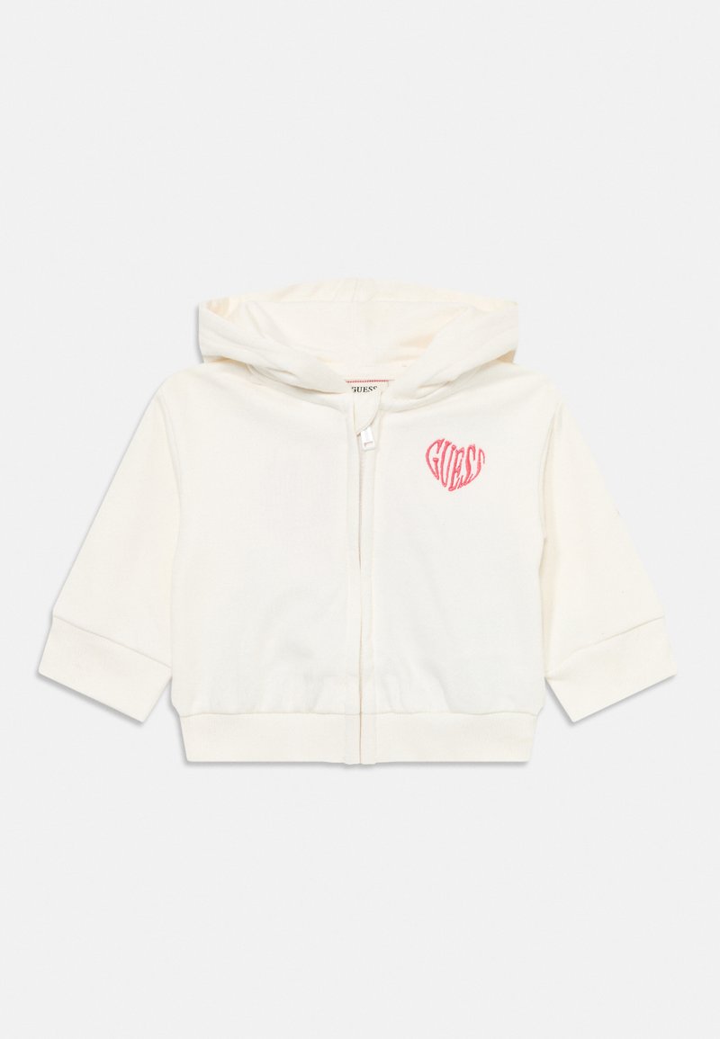 Ivory zip-up hoodie with short sleeves, soft fabric, features a pink heart logo on the left chest, and a drawstring hood.