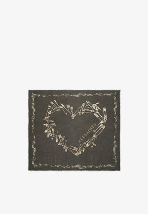 Tessuto scuro con spilli da balia disposti a forma di cuore e bordo, testo "ALLSAINTS" all'interno del cuore sul lato destro.