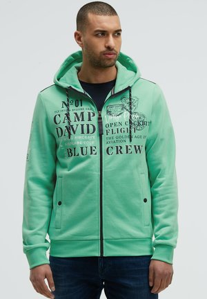 MIT KAPUZE UND LOGO ARTWORKS - Zip-up sweatshirt - flight green