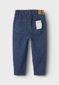 Blue denim pants featuring a stretchy waist, back pockets, and a pattern of red hearts throughout. Includes a label on the back.