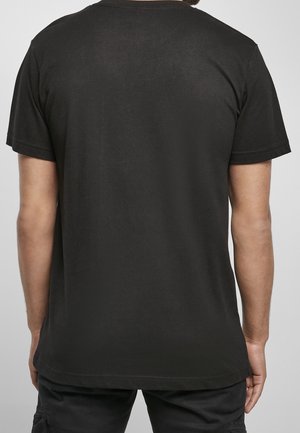 Zwart short-sleeved t-shirt van katoen, met een ronde hals en een rechte zoom. Gladde textuur zonder zichtbare patronen of accenten.