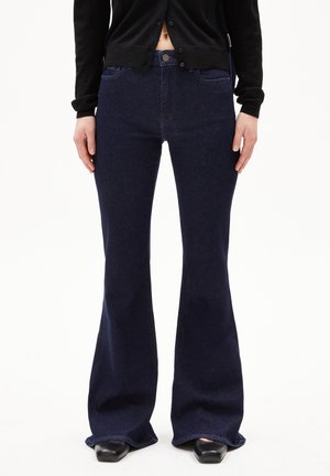 Flared dark blue jeans made of denim, featuring a front button closure, five pockets, and a smooth texture.